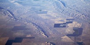 An aerial photograph looking southwest over both the Coalinga and Kettleman Hills folds